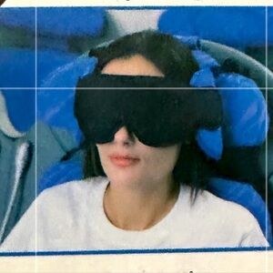 Amazon Basics Travel Pillow with attached eye mask.